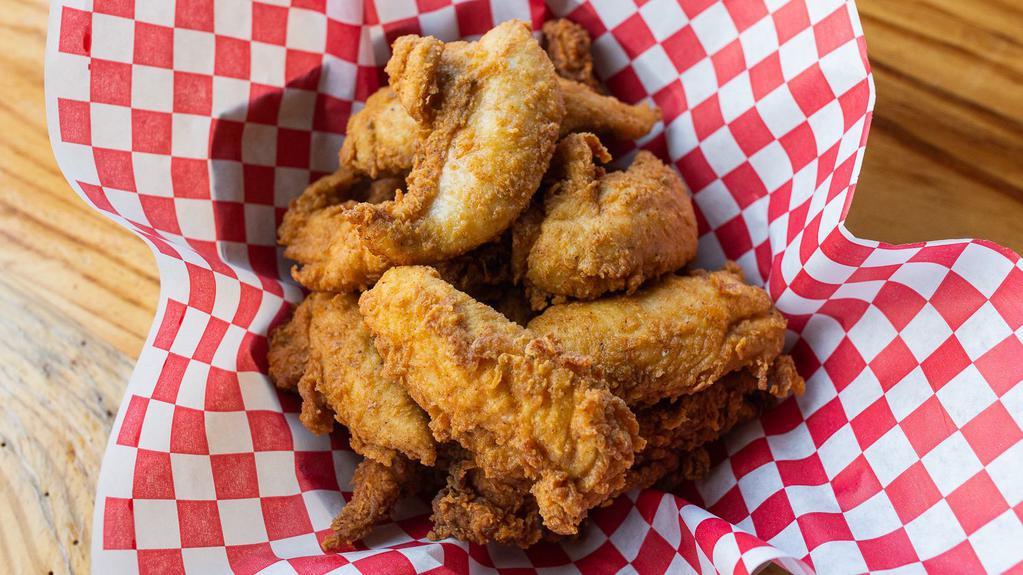 Chicken Tender Basket · Hand breaded chicken tenders tossed in your choice of sauce