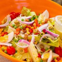 Chopped Salad · Chopped baby romaine hearts, tomatoes, red onions, bacon, roasted corn, peas, red peppers, s...