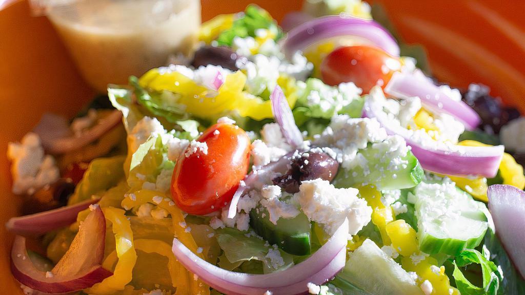 Greek Salad · Gluten free. Baby romaine hearts, tomatoes, red onion, cucumbers, feta cheese, kalamata olives, banana peppers, and Greek vinaigrette.