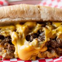 Philly Cheesesteak Sandwich · Thinly sliced Ribeye seared to perfection , carmelized onions and peppers, American cheese, ...