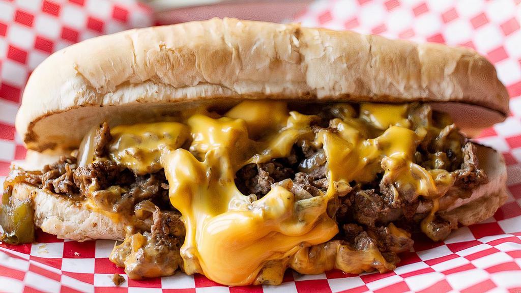 Philly Cheese Steak  · Thinly sliced ribeye seared to perfection, caramelized onions and peppers, American cheese, and hoagie roll.