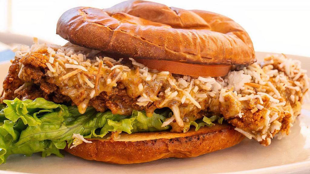 Fried Chicken (Coconut Style) · Fried breast of chicken tossed with honey mustard and topped with toasted coconut, lettuce, tomato, pretzel roll.