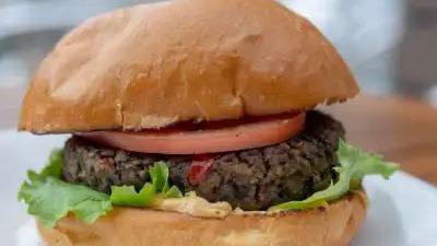 Black Bean Veggie Burger · House-made black bean patty (with roasted red peppers, onion and garlic), lettuce, tomato and chipotle mayo on a brioche bun.