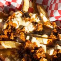 Chili Cheese Fries · Gluten free. Topped with house-made chili and melted cheese