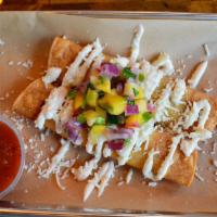 Chicken Taquitos · Pulled chicken, diced bell peppers & onions, Jack cheese blend, served with mango habanero s...