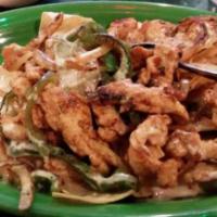 Shredded Chicken Nachos · A bed of crispy tortilla chips with seasoned chicken cooked with onions, bell peppers, tomat...
