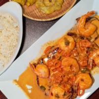 Pechuga A La Plancha Con Camarones · Grilled chicken breast and shrimp topped with mushrooms cream served with rice, beans, and g...