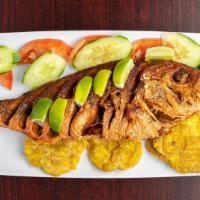 Pargo Frito · Fried red snapper, served with salad, rice, and green plantains.