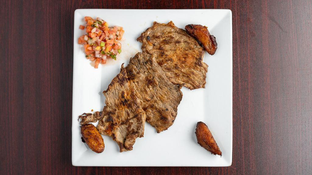 Carne Asada · Top round steak, served with rice, beans and sweet plantains.