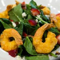 Fried Shrimp Spinach · Gulf shrimp and baby spinach, tossed with dried cranberries, candied pecans, bleu cheese cru...