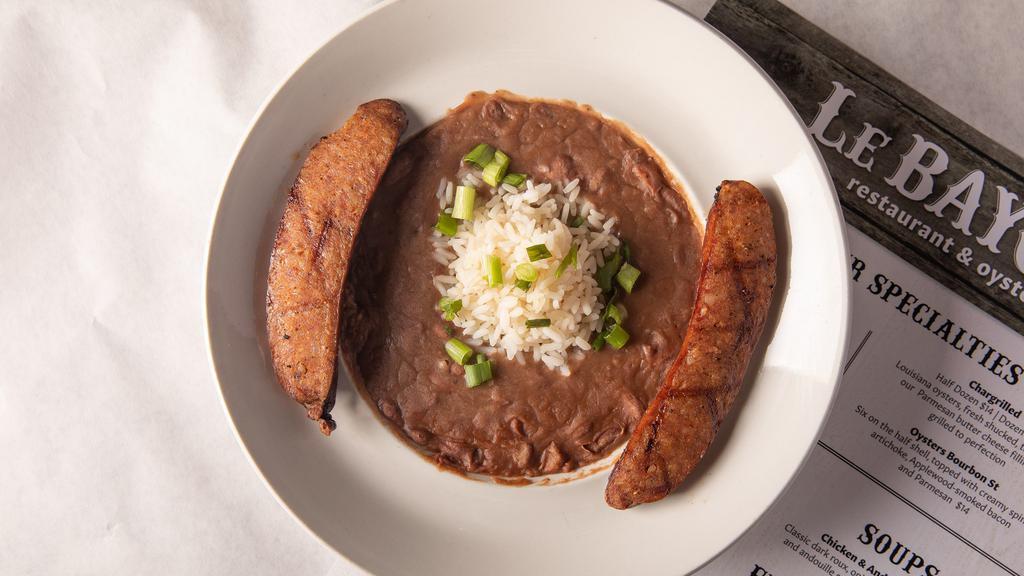 Creole Red Beans & Rice · Creamy, slow-simmered red beans served with white rice, andouille sausage, and fried chicken.