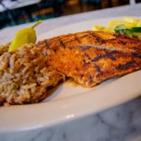 Blackened Redfish · Fresh Louisiana catch blackened with Cajun seasonings and served with steamed vegetables and...