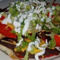 Lz Nachos · Your choice of Chicken or Steak, pinto beans, lettuce,
sour cream, queso dip, tomato and jal...