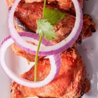 Tandoori Wings (6) (Gluten Free) · Chicken wings marinated in spice mixtures, roasted in tandoor oven.