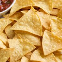 Warm Tortilla Chips · Fresh homemade tortilla chips served with your choice of queso blanco, pico de gallo or guac...