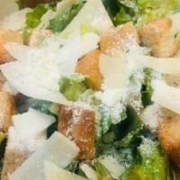 Caesar Salad · Fresh romaine, shaved parmesan, croutons and caesar dressing.