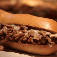 Philly Cheesesteak Supreme · The Classic Original Philly made with Shaved Prime Ribeye Steak Tossed with Grilled peppers,...