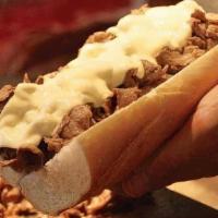 Original Philly Cheesesteak · The Classic Original Philly made with Shaved Prime Ribeye Steak Tossed with Grilled onions a...