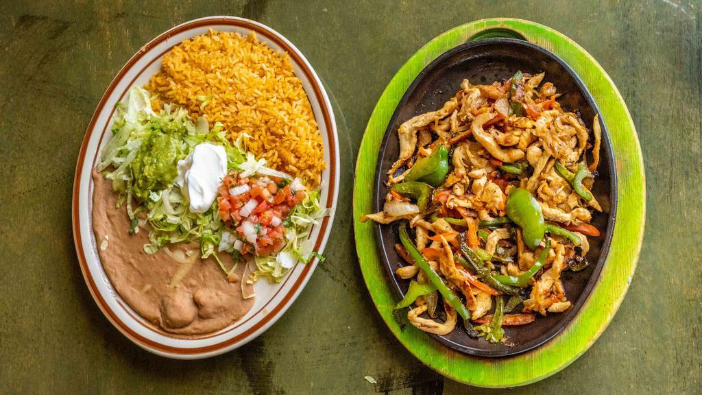 Fajitas · We use our special recipe to cook tender strips of chicken, or steak, or mixed.