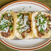 Fish Tacos · Three flour tortillas stuffed with flakey chunks of grilled tilapia, pico de gallo, lettuce,...