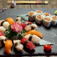 Sushi Deluxe · 13 pieces of chef choice sushi with spicy tuna roll .