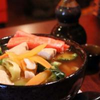 Seafood Udon · Udon noodle broth with veggie, salmon, white tuna. red snapper. shrimp .crab.