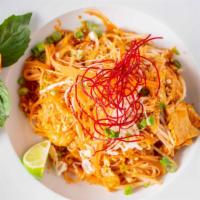 Pad Thai · Traditional stir fried rice noodle dish with egg, bean sprout garnished with fresh ground pe...
