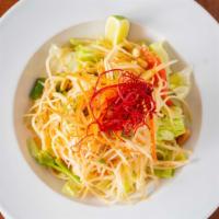 Som Tum (Papaya Salad) · This classic salad is popular throughout Thailand for centuries. Shredded green papaya, carr...
