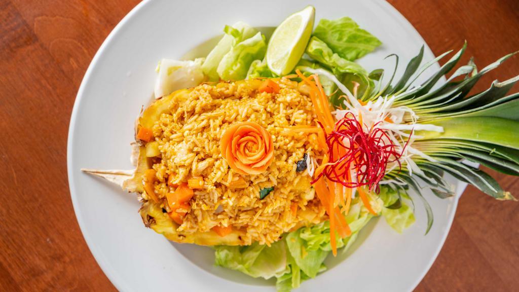 Pineapple Fried Rice · A fancier fried rice dish - combines fragrance of jasmine rice with eggs, sweet, juicy and tangy pineapple, crunchy roasted cashews and delectable raisin - stir fried with anthony’s special sauce.