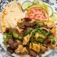 Mixed Grill · Gyros and chicken with grilled onions and green peppers.