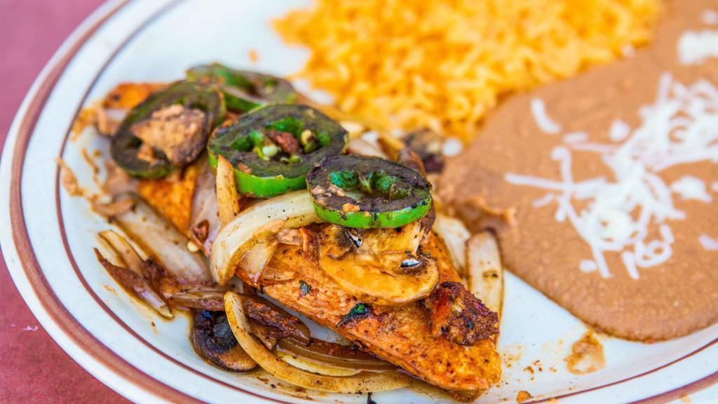 Pollo Borracho · Thin sliced chicken breast topped with sautéed jalapeño, onions and mushrooms glazed in white wine sauce. Served with rice and beans. Usda choice top sirloin hand cut daily.