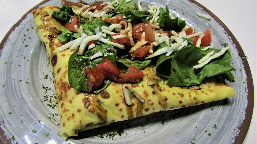 Caprese Crepe · Scratch made crepe topped with fresh spinach, diced tomatoes, house made pesto, mozzarella cheese, and a house made honey balsamic drizzle