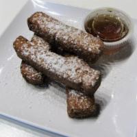 French Toast Sticks (Kids) · 4 delicious whole grain French toast sticks sprinkled w/powdered sugar & served w/a side of ...
