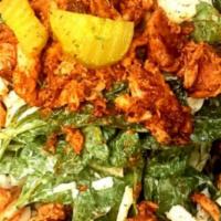 Hot Chicken Salad · Fresh spinach topped with smoked pulled chicken cooked in our Nashville hot seasoning along ...