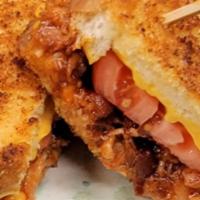 Not Your Mom'S Grilled Cheese · Smoked BBQ pulled chicken, melted American cheese, bacon, and fresh tomato in between 2 piec...