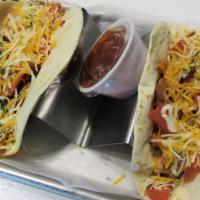 Chicken Tacos · Smoked pulled chicken topped with diced tomatoes and cheddar jack cheese served in your choi...