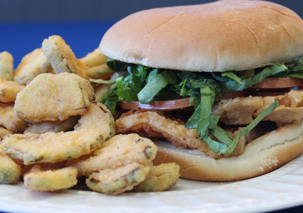 Pork Chop Sandwich · Boneless center cut pork chop - grilled or fried on a bun with lettuce, tomato, and mayo.