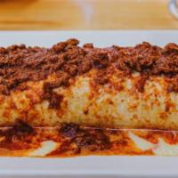 Black And Gold Burrito · Favorite. A huge burrito filled with ground beef or shredded chicken, rice, and beans. Toppe...