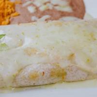 Burritos Tapatios · 2 grilled chicken or steak burritos topped with cheese dip. Served with beans, rice, lettuce...