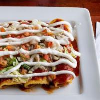 Enchiladas Supreme · A bean, cheese, beet, and chicken enchiladas topped with lettuce, pico de gallo, and sour cr...