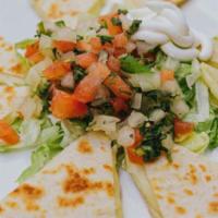 Quesadilla Dinner · Favorite. A chicken or beef quesadilla. Served with rice, beans, lettuce sour cream, and tom...