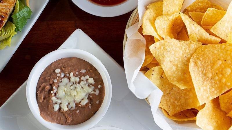 Dip Trio · A combination of our refried beans, queso Blanco, and guacamole. Please note that no modifications can be accommodated.
