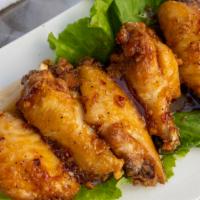 Fish Sauce Fried Chicken Wingz · 5-pc fried jumbo chicken wings sautéed in house-blended fish sauce.