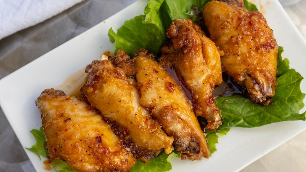 Fish Sauce Fried Chicken Wingz · 5-pc fried jumbo chicken wings sautéed in house-blended fish sauce.
