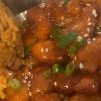Kickin Popcorn Shrimp · Fried popcorn shrimp tossed in Sweet Heat sauce and served with fries or jambalaya rice (con...