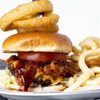 Western Bbq Burger · Bbq sauce, melted cheddar cheese, bacon and onion rings piled high on a toasted brioche bun....