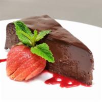 Chocolate Sin Cake · Rich flourless cake, ganache, raspberry sauce | gf