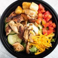 House Salad · Mixed greens with cucumbers, tomatoes, Cheddar cheese, onions, croutons.