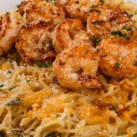 Shrimp Garlic Noodles · Thin spaghetti and shrimps tossed in our garlic butter seasoning, accented with Parmesan che...