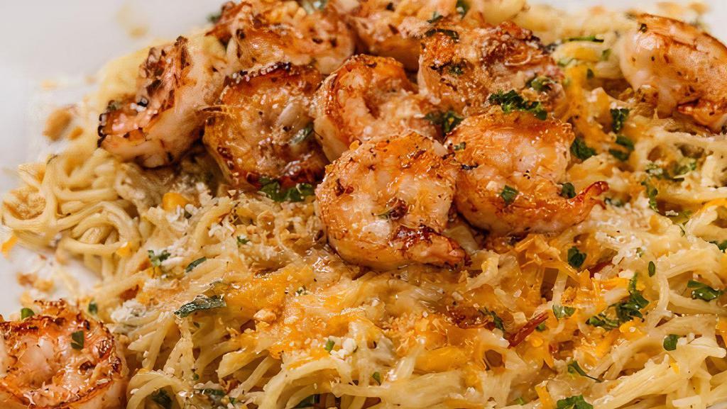 Shrimp Garlic Noodles · Thin spaghetti and shrimps tossed in our garlic butter seasoning, accented with Parmesan cheese and fried shallots. Comes with a side of your choice.